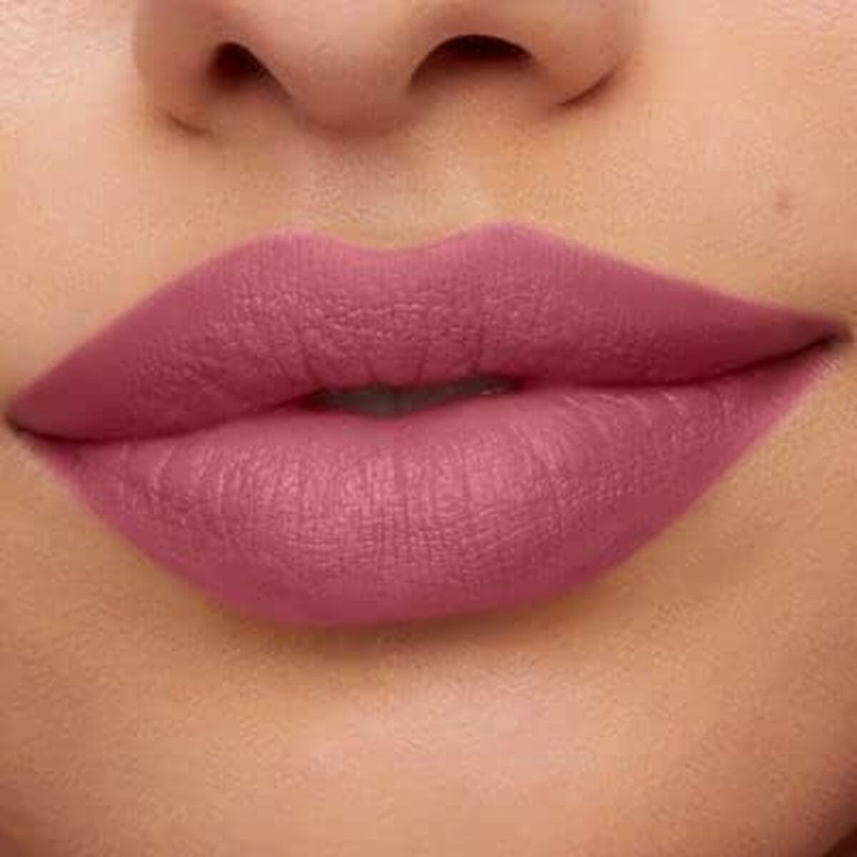 Lips wearing bareMinerals Mineralist Charming Pink lipstick, showcasing a soft pink color, smooth matte finish.