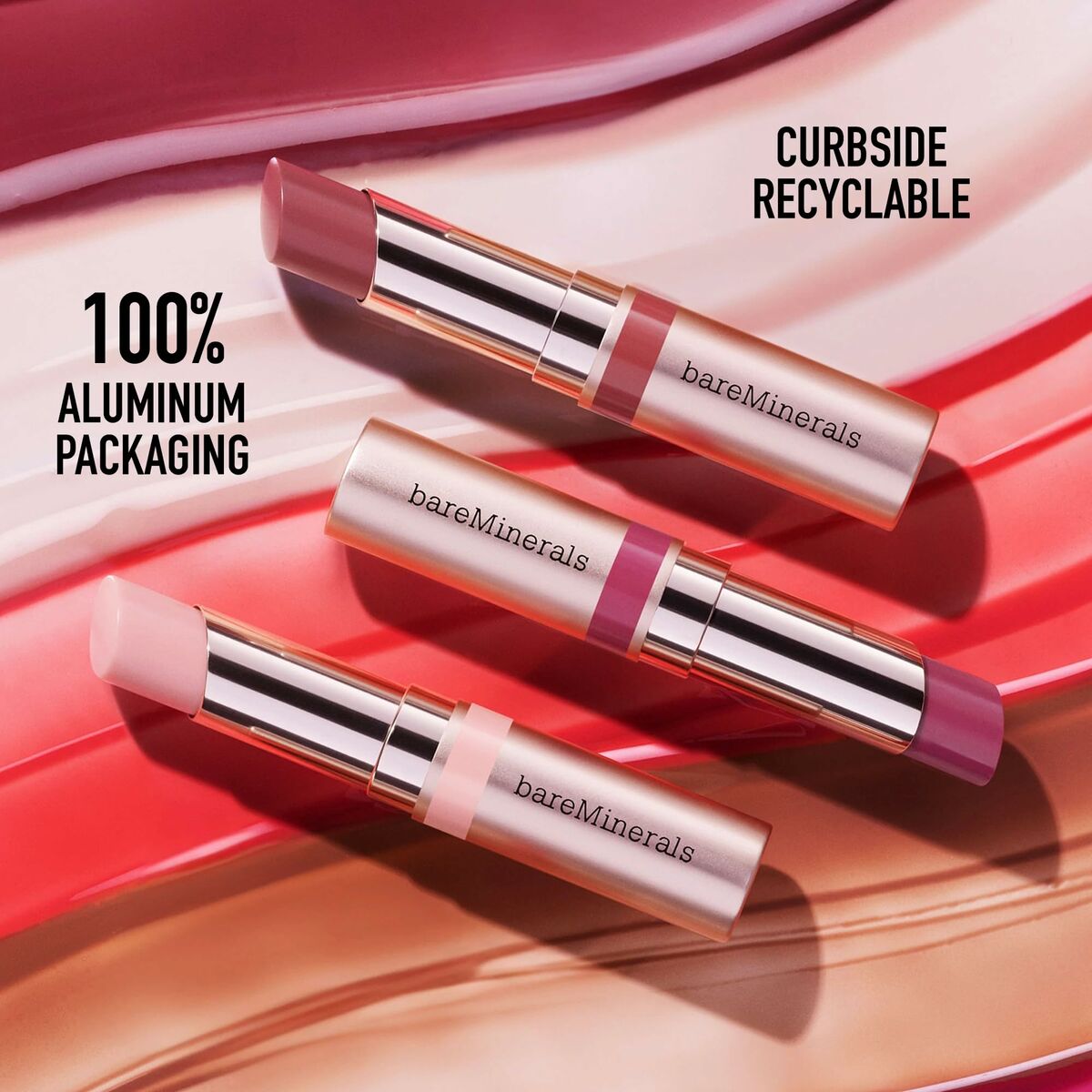 BareMinerals lipsticks in 100% aluminum packaging, featuring three shades on a vibrant color backdrop.
