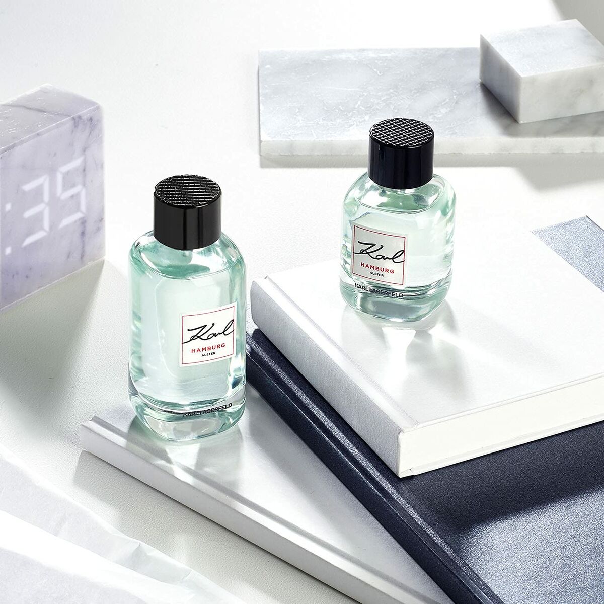 Bottles of Parfum Homme Karl Lagerfeld Karl Hamburg Alster 60 ml on a stylish surface, showcasing a sophisticated fragrance choice.