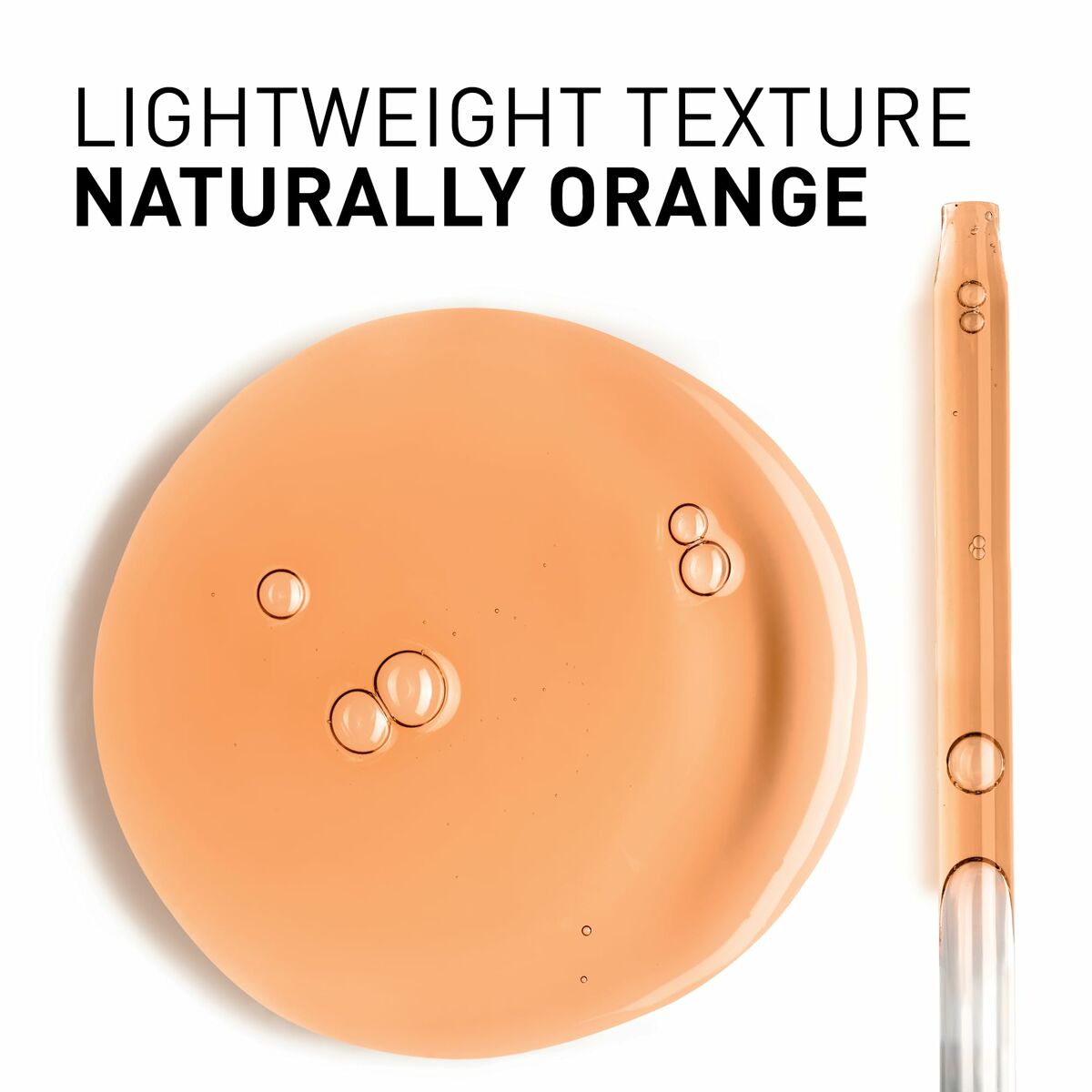 Lightweight orange serum texture with droplets on a plate, showcasing its smooth consistency.