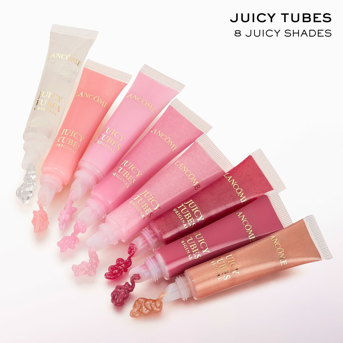 Collection of Lancôme Juicy Tubes in 8 vibrant shades for a luscious lip look.