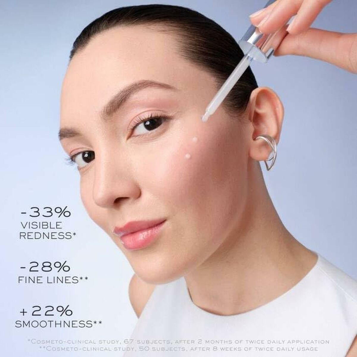 Woman applying Lancôme GÉNIFIQUE serum, showcasing visible skin improvement results.