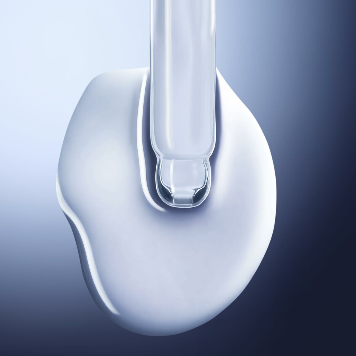 Texture of Crème de jour Lancôme GÉNIFIQUE showing a smooth and luxurious serum for skincare.