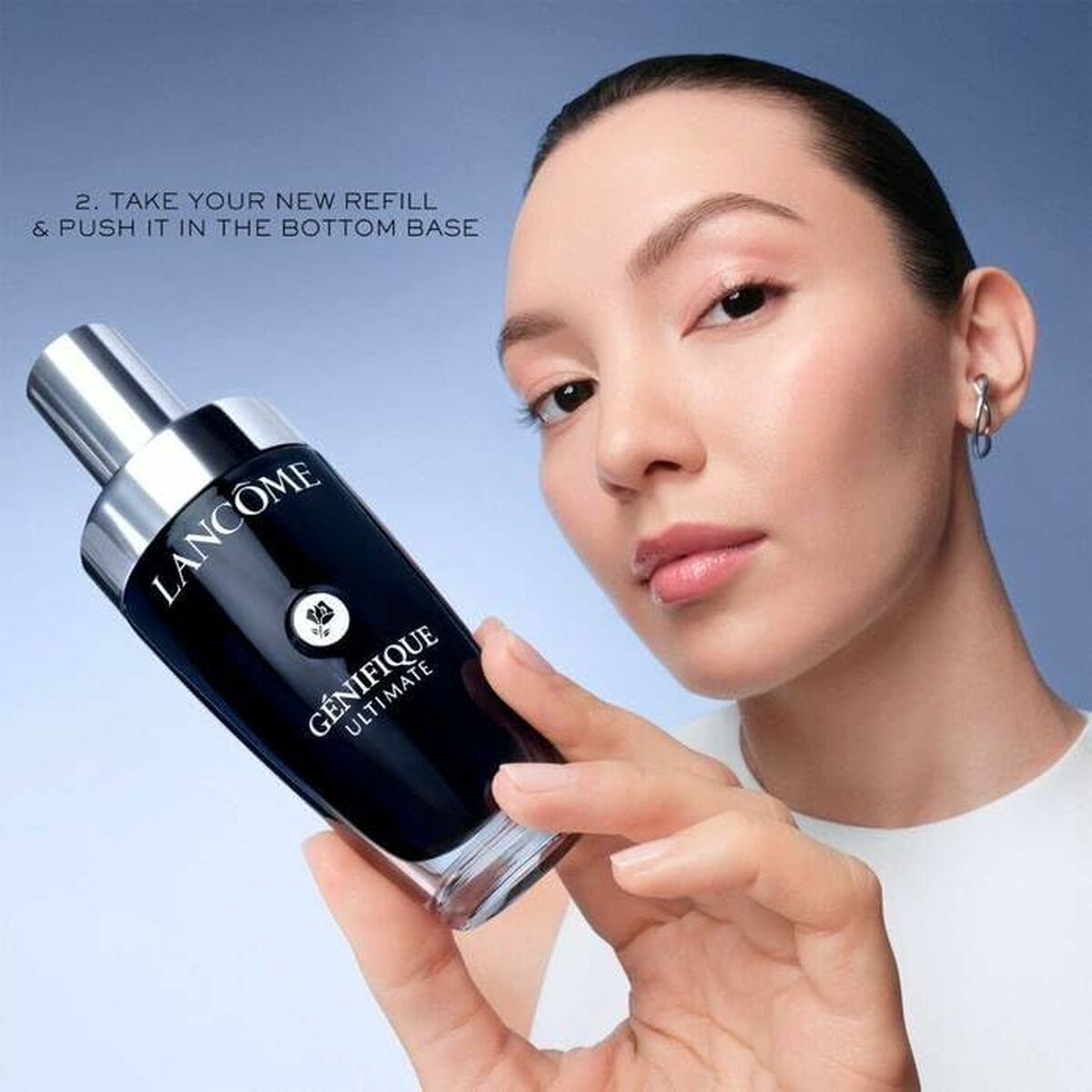 Model demonstrating Lancôme GÉNIFIQUE refillable serum with a focus on sustainable beauty solutions.