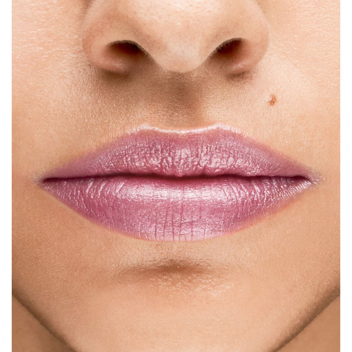 Close-up of soft, glossy lips featuring a light purple shade, showcasing makeup beauty.