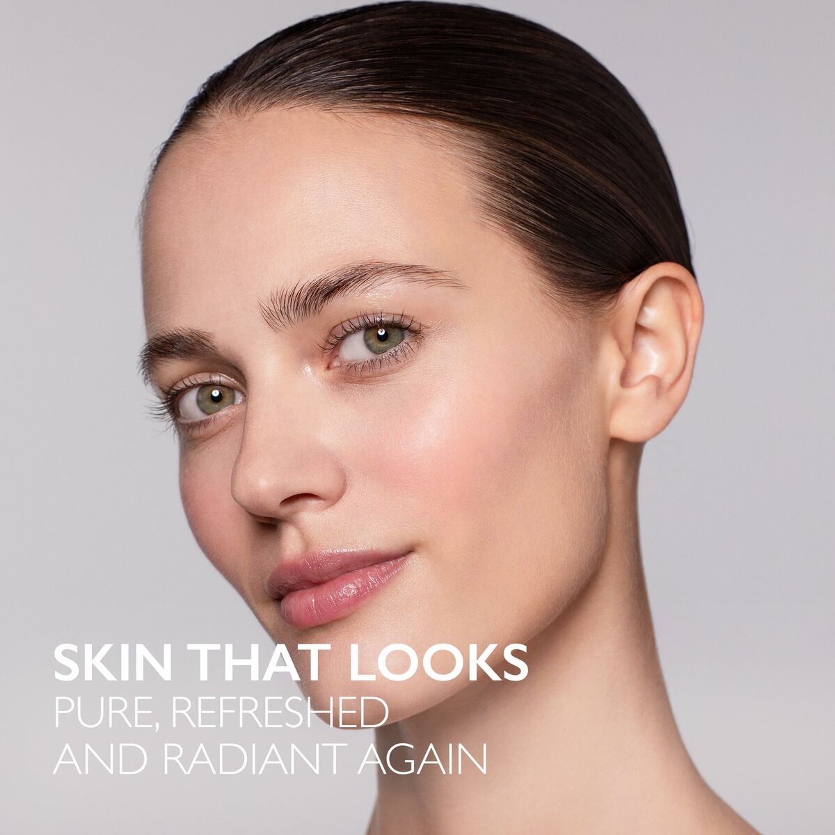 Close-up of a woman with clear, radiant skin promoting a fresh and pure look using Lancaster Cleansers.