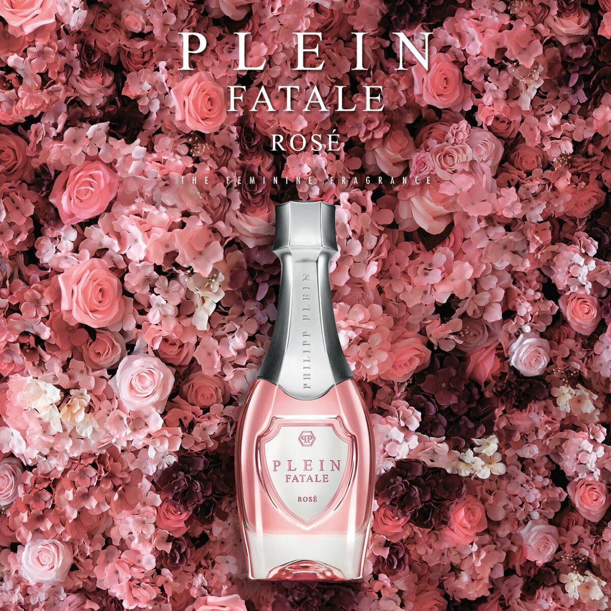 Parfum Femme PHILIPP PLEIN Plein Fatale Rosé surrounded by pink roses, showcasing femininity and elegance.