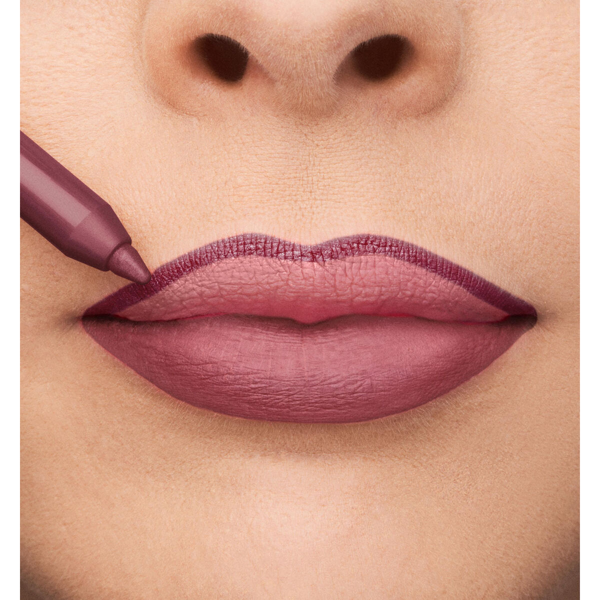 Applying Collistar Professionale Nº 112-Iris Fiorentino lipstick on full lips for a glamorous look.