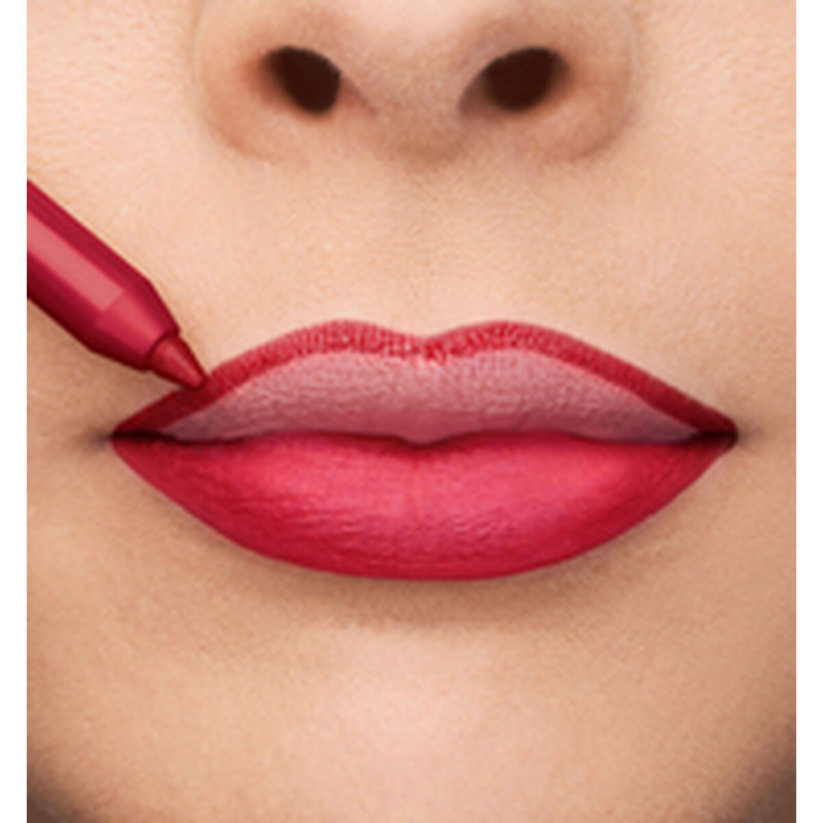 Application of red lipstick, showcasing vibrant lips with precise lip liner, perfect for enhancing beauty.