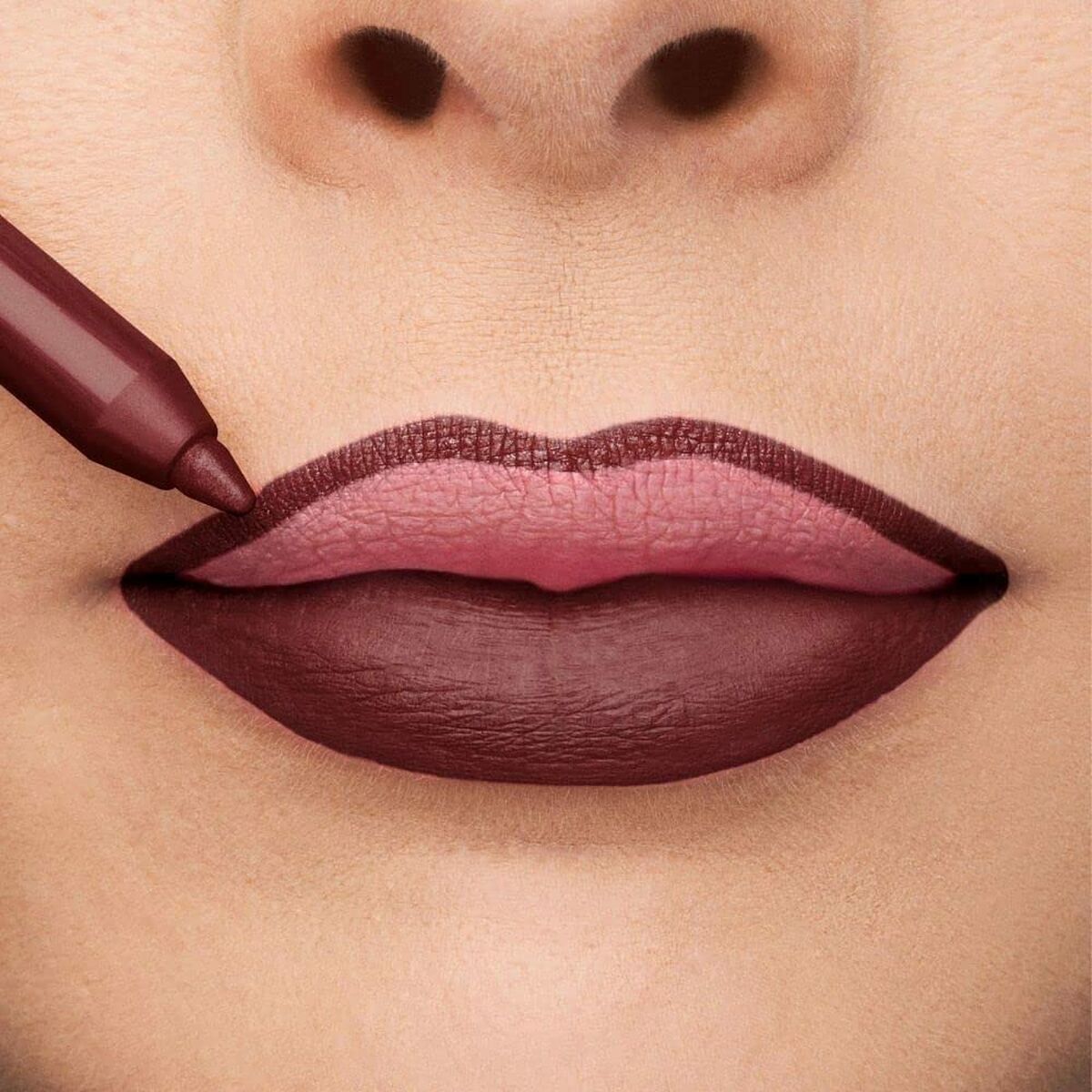 Application of Collistar Professionale Nº 14-Bordeaux lipstick on model's lips, showcasing bold burgundy color.