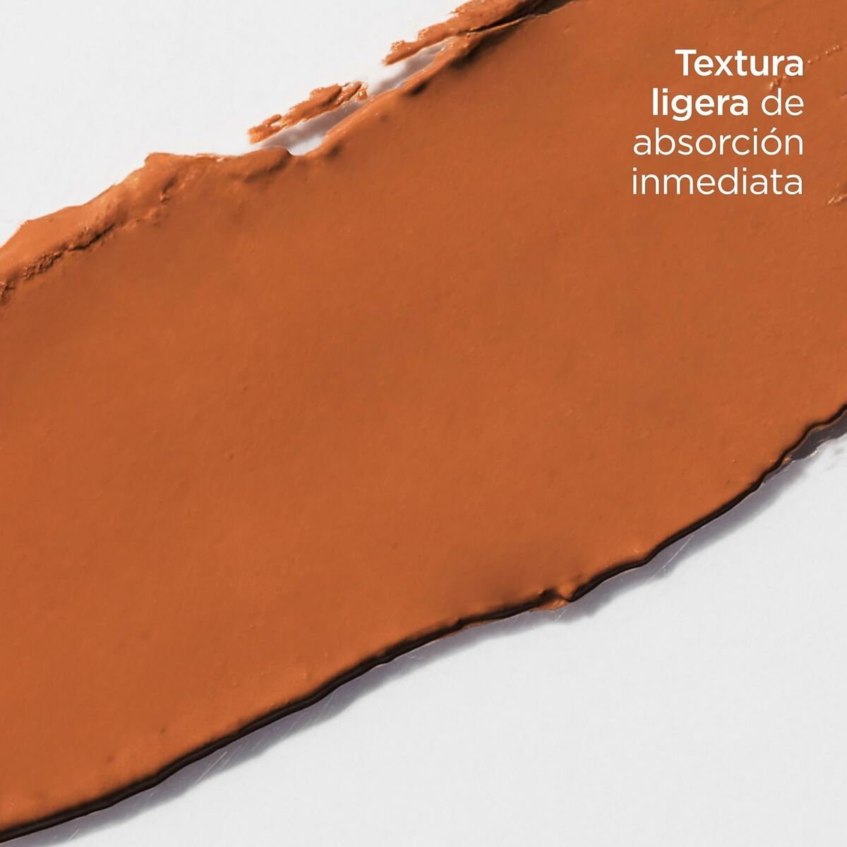 Texture of Isdin makeup showing lightweight and immediate absorption properties in a rich brown shade.