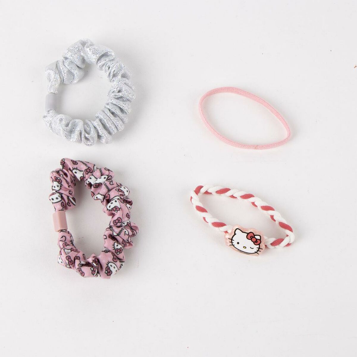 Quatre accessoires pour les cheveux Hello Kitty : élastiques colorés et mignons pour enfants.